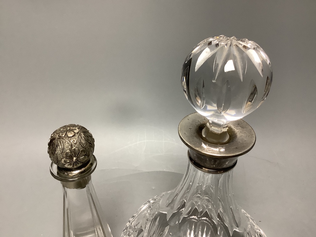 A silver collared cut glass decanter and a glass scent bottle with 800 standard silver stopper, tallest 27cm and a set of 5 etched wine glasses.